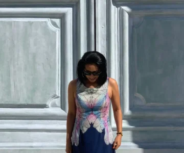 A woman looking down with emotional constipation