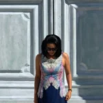 A woman looking down with emotional constipation