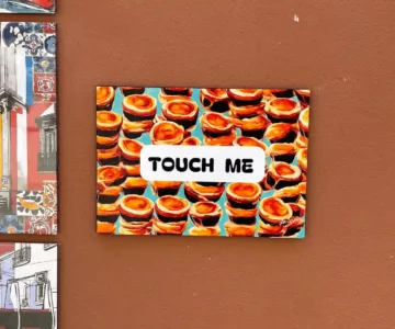 An artwork with the words "touch me"